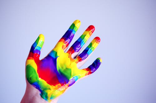Free Person's Hand With Paints Stock Photo