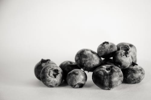 Grayscale Photography of Blueberries