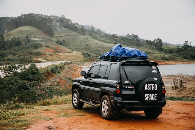 Black Crossover Car Standing Off Road