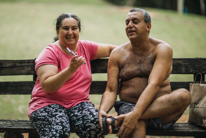 dating middle aged woman – couple smiling on a park bench