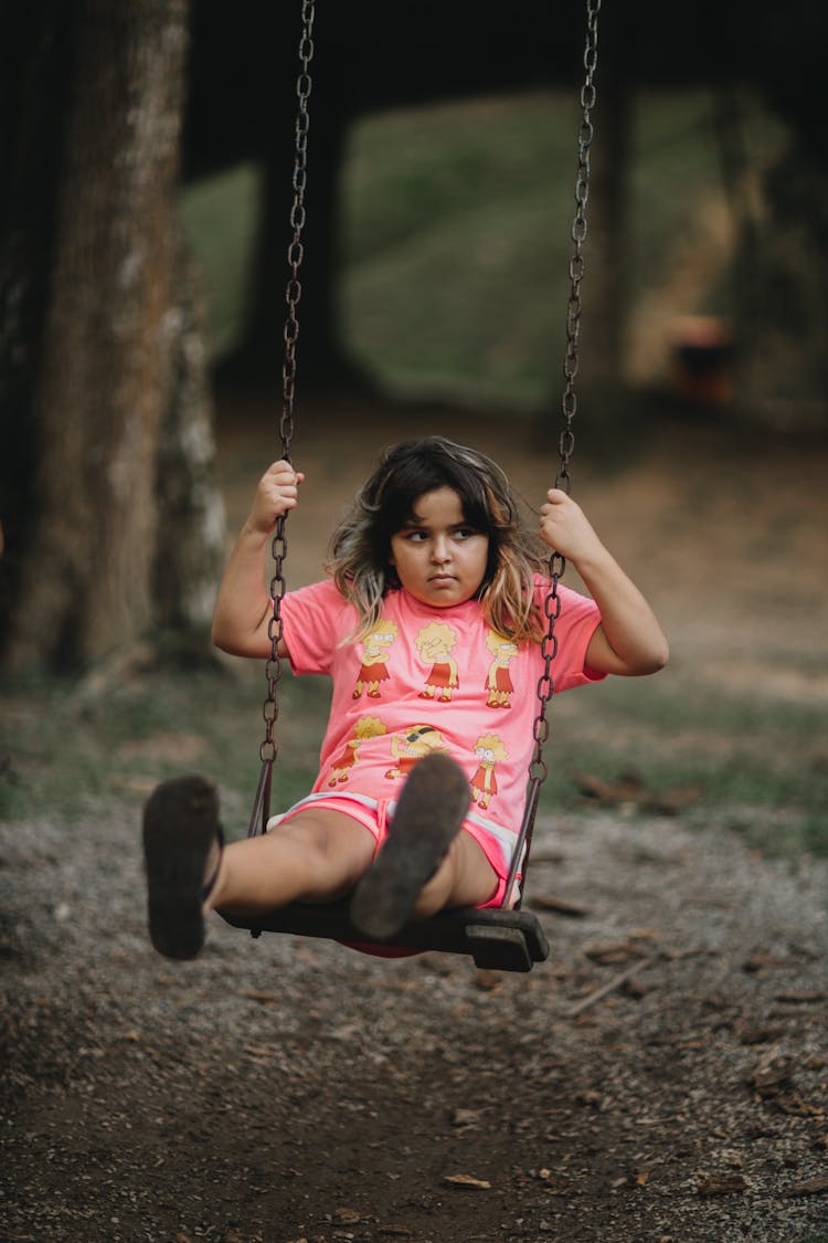 Photo Of Girl On A Swing