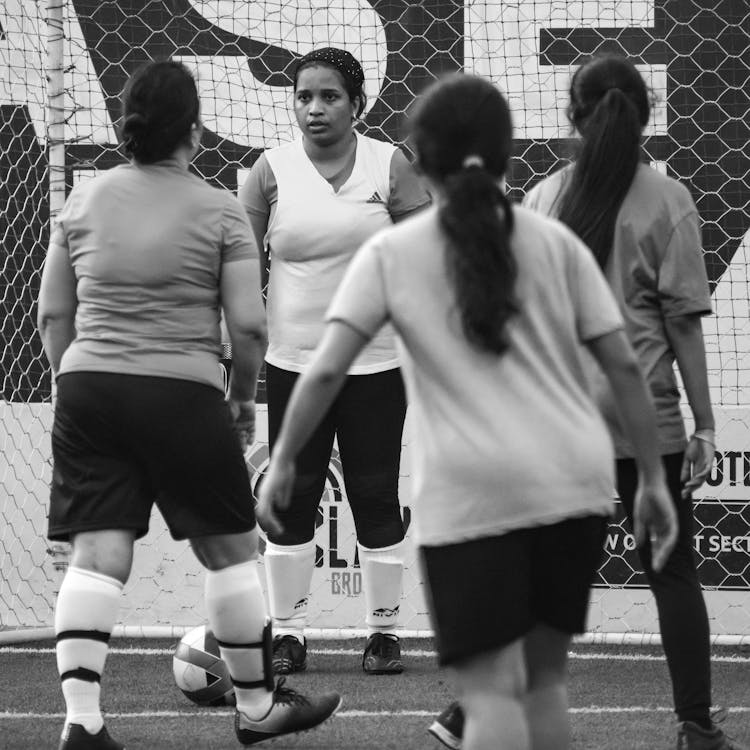 Black And White Photo Of Women Playing Soccer 