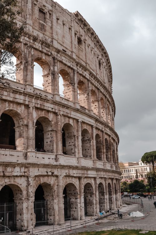 Free A captivating exterior view of the historic Colosseum in Rome, perfect for travel and history enthusiasts. Stock Photo