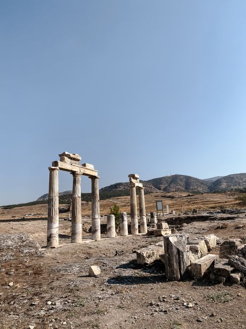 Free Explore the majestic ancient Roman ruins standing under a clear sky in Pamukkale, Turkey. Stock Photo