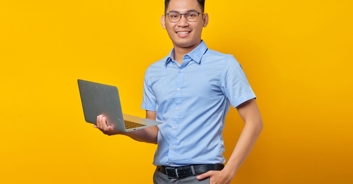Person holding a laptop with multiple digital certification badges floating around them