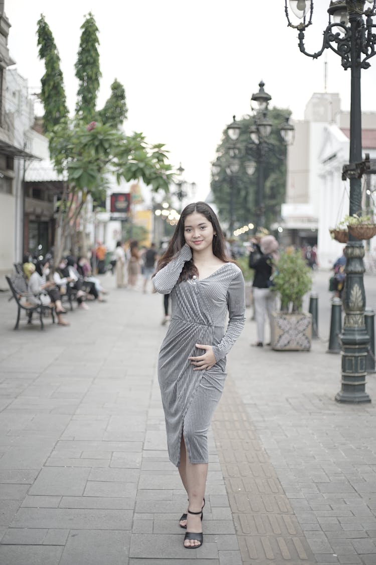 Woman Wearing A Gray Dress 