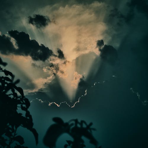 Low Angle Shot of Cloudy Sky with Sunbeam 