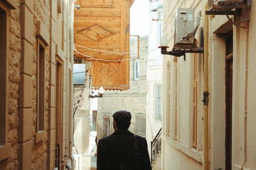 Free Explore a quaint street in Baku, Azerbaijan through this charming alleyway capture. Stock Photo