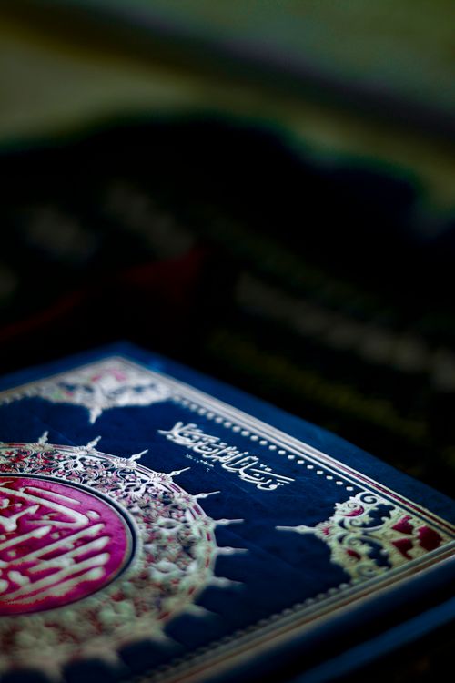 Free Close-up of an ornate Quran cover with intricate designs and velvet texture. Stock Photo