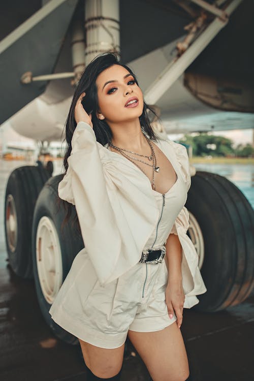 Free Woman Posing Beside an Aircraft Stock Photo