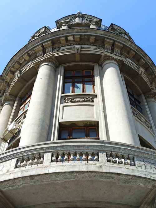 Free Low angle view of a historic building facade with grand columns in Romania. Stock Photo