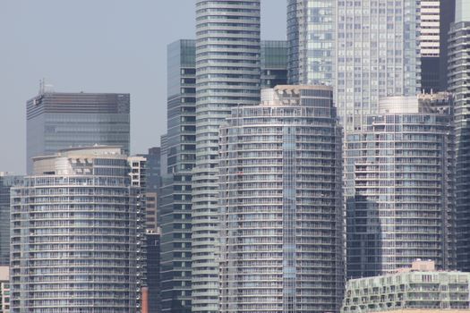 Close-up view of shining skyscrapers in a bustling urban environment.