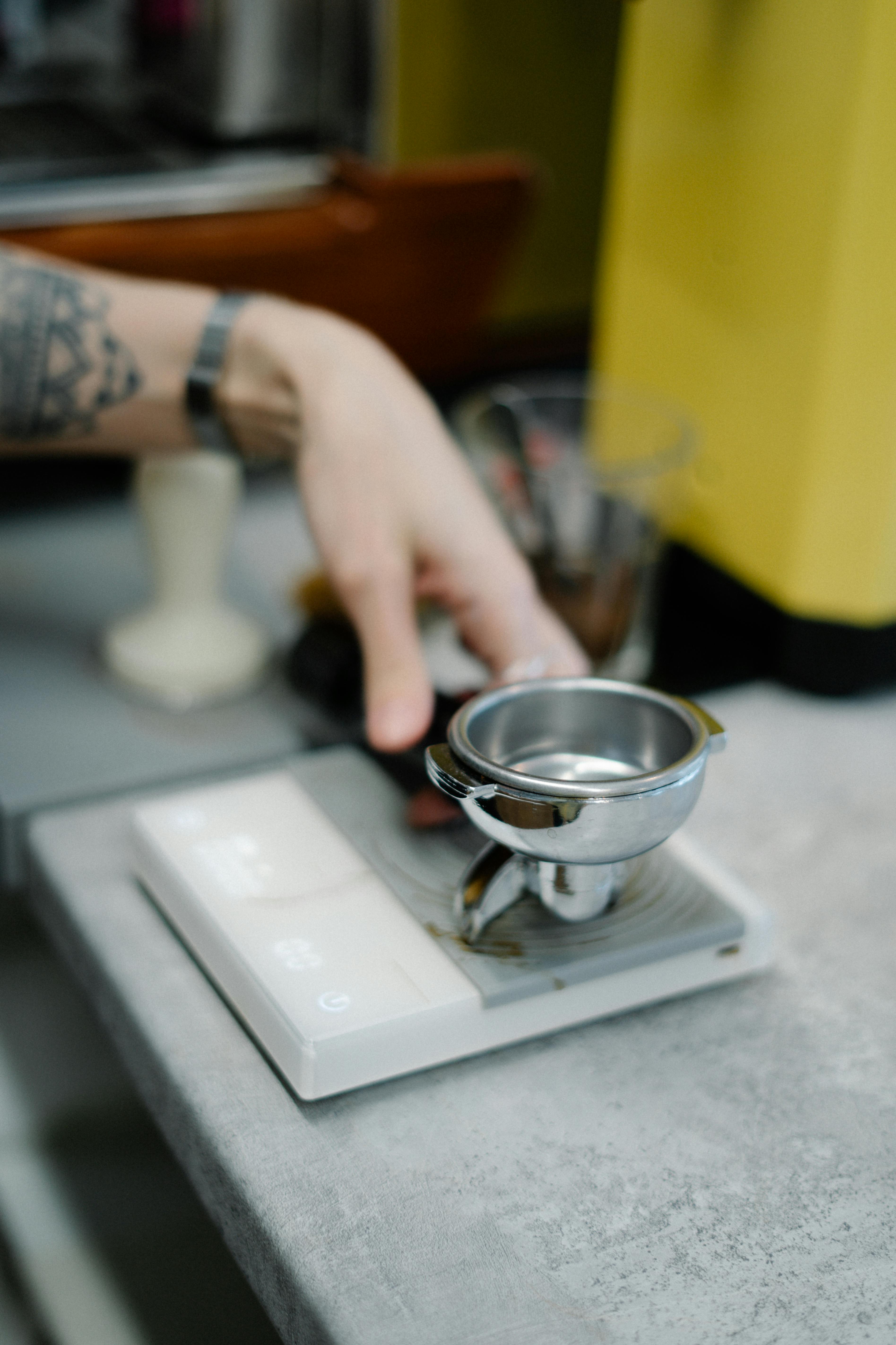 Portafilter on digital scale for precise espresso dosing