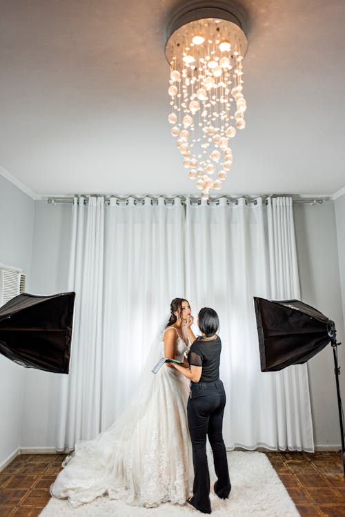 Make-up Artist and a Bride in a Studio 