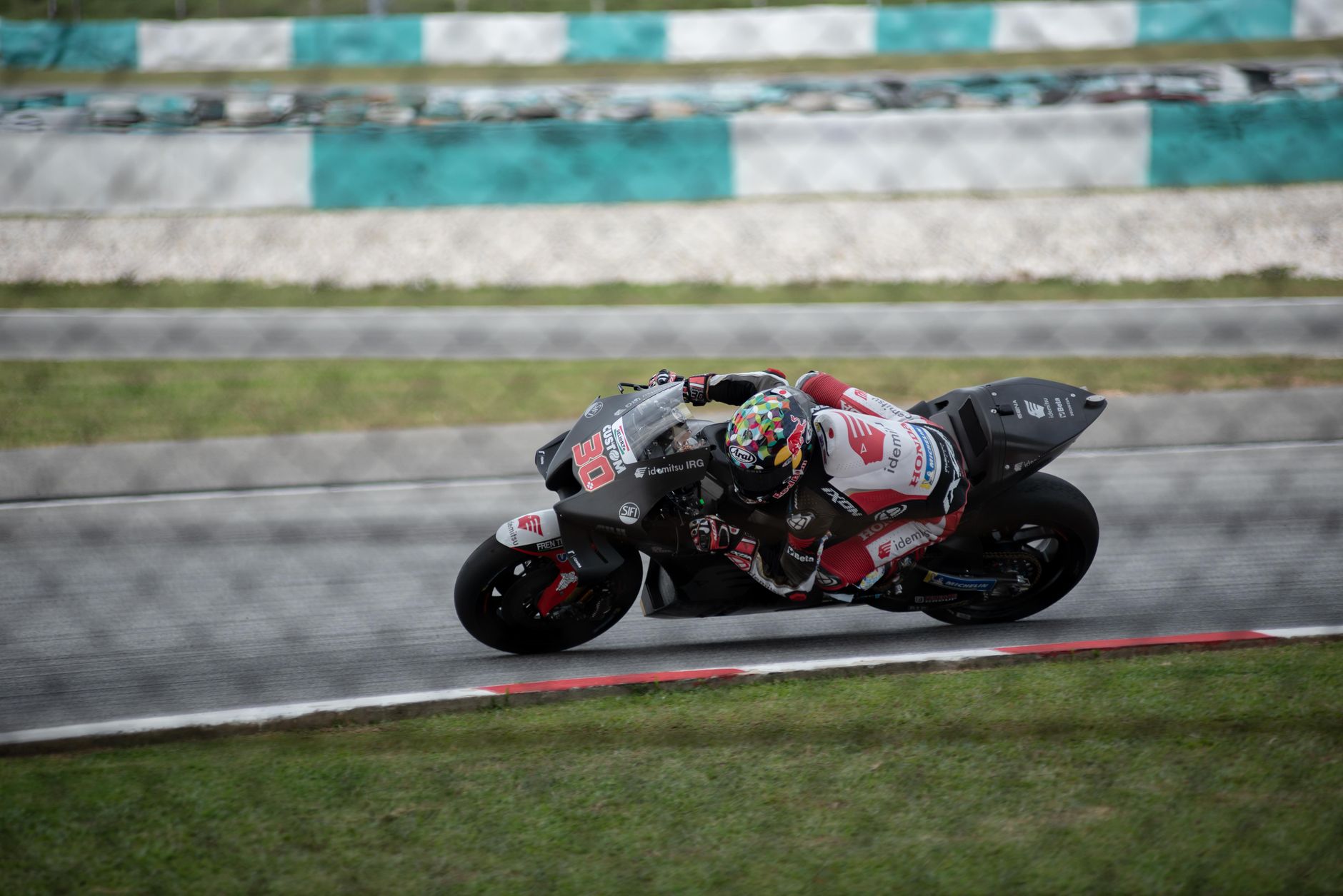 Exciting motorcycle race capturing high-speed action on a professional race track.