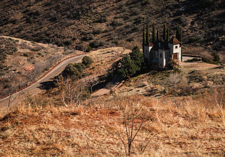 White And Brown House On Brown Hill