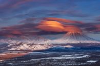 Sunset Over Snowcapped Mountains and Volcanoes