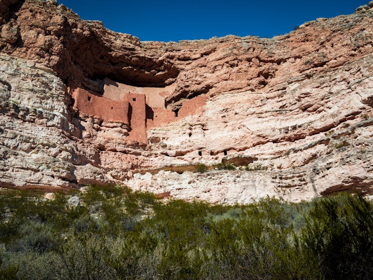 Ancient Dwellings Carved On Rock Mountain