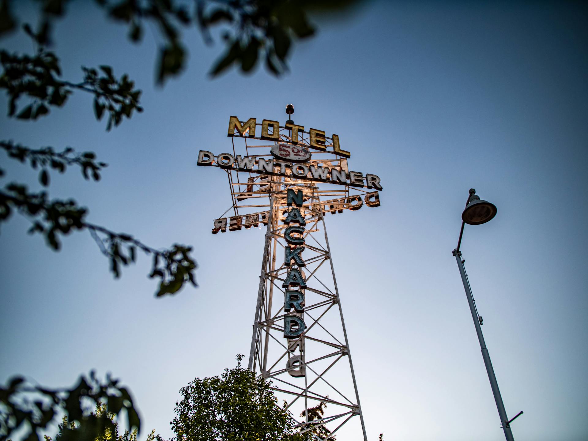 Low Angle Shot of a Tower with the Downtowner Motel Sign, Flagstaff, Arizona