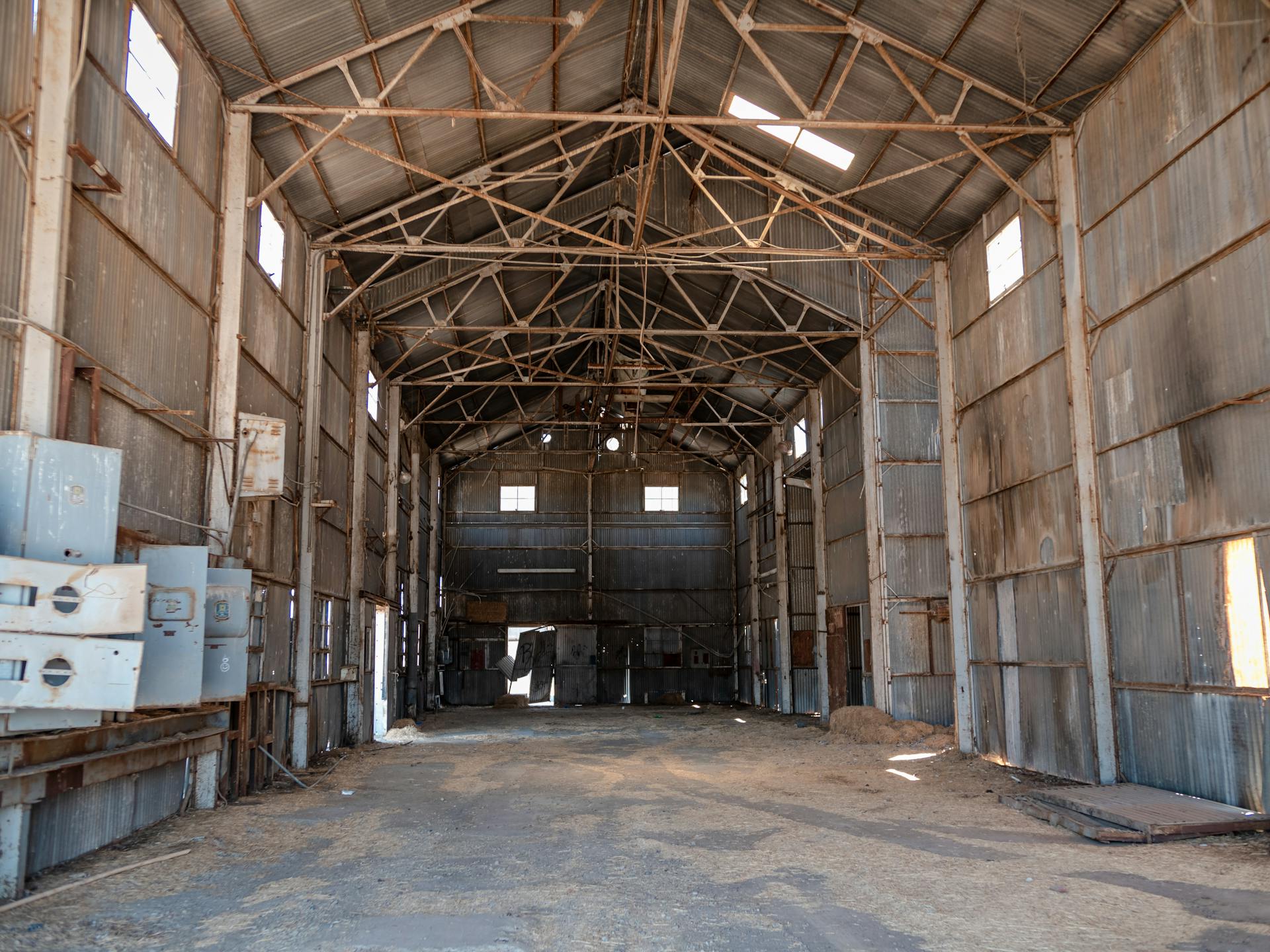Explore the rustic charm of an old abandoned warehouse interior in Arizona with natural lighting.