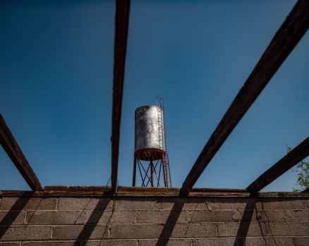 Rusty Tank under Clear Sky 