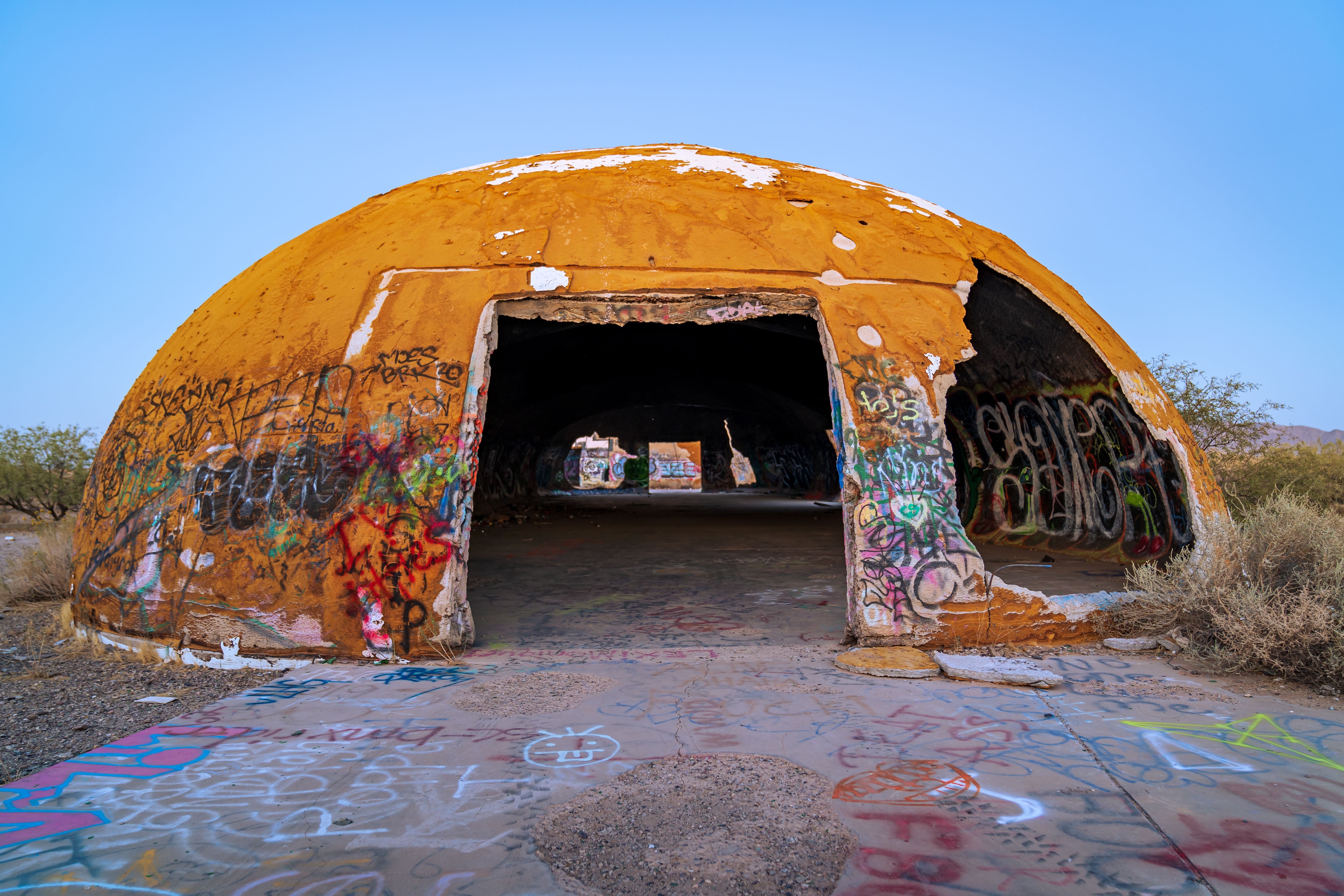 Explore the colorful graffiti on an abandoned dome in the Arizona desert.