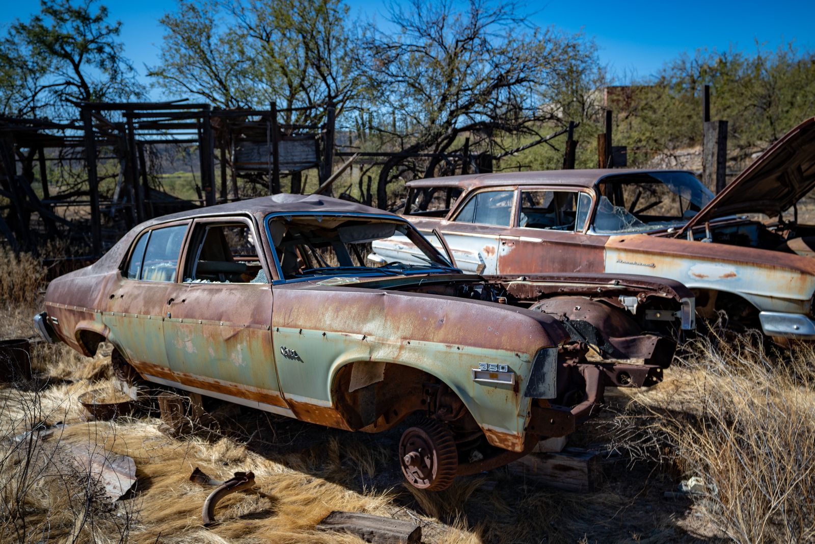 Old rusty abandoned cars ready for junk removal and recycling