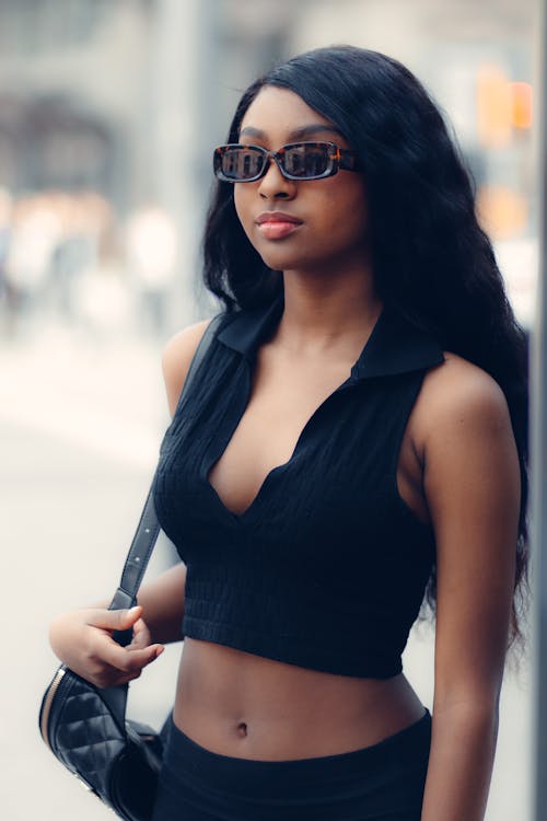 Close-up Photo of Beautiful Woman in Black Top and Sunglasses