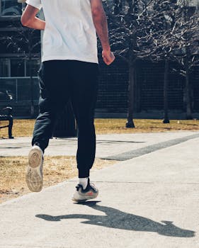 A person jogging outdoors on a sunny day, capturing the essence of fitness and healthy living.