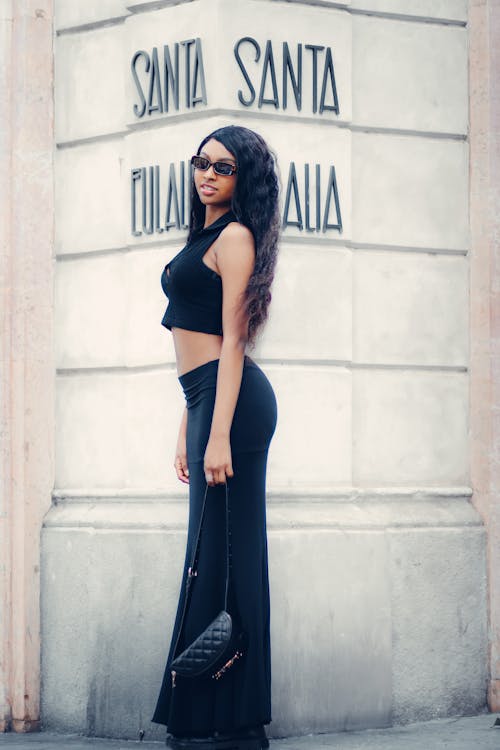 Stylish Woman in Black Crop Top and Long Black Skirt 