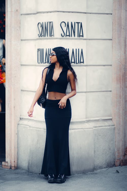 Stylish Woman in Black Crop Top and Long Black Skirt