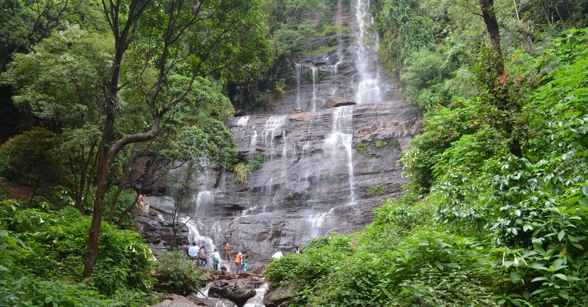 Beautiful waterfall cascading through lush greenery in Chikmagalur, India.