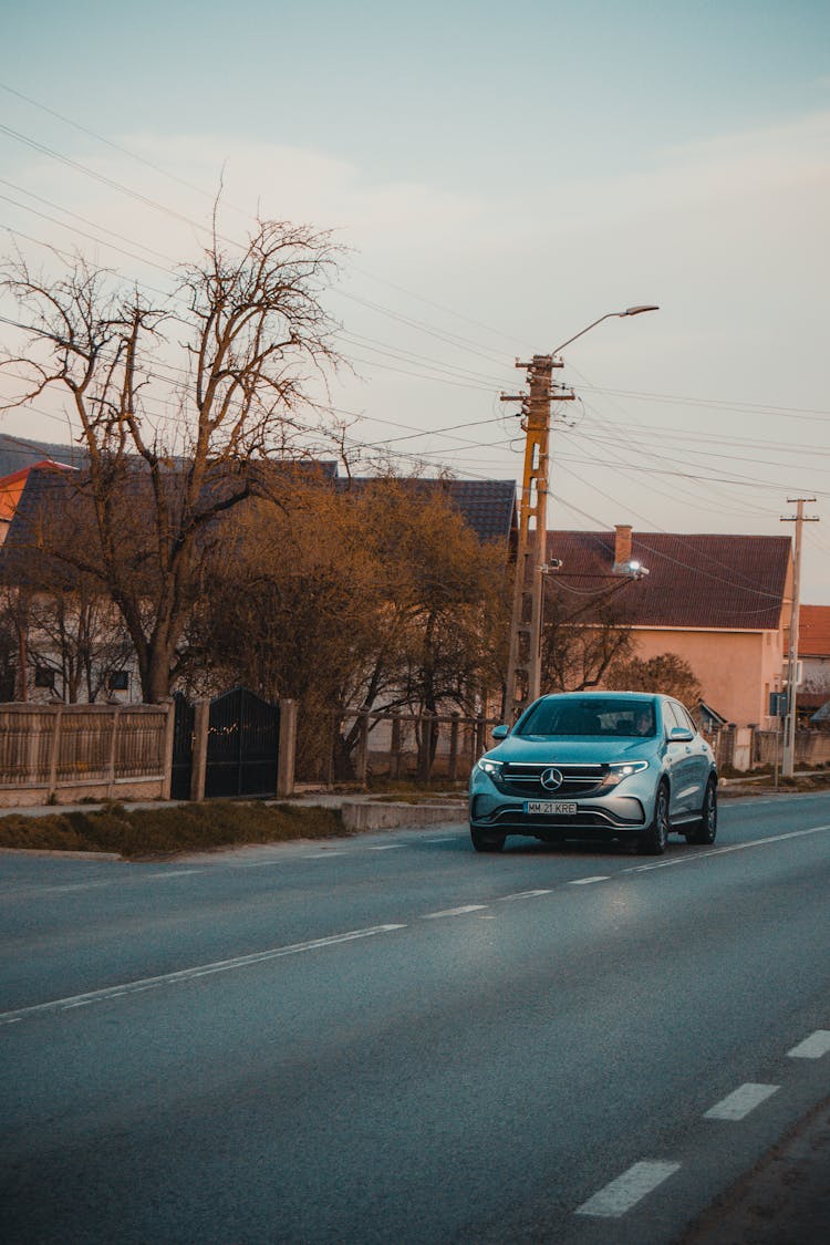 Car Driving On Asphalt Road