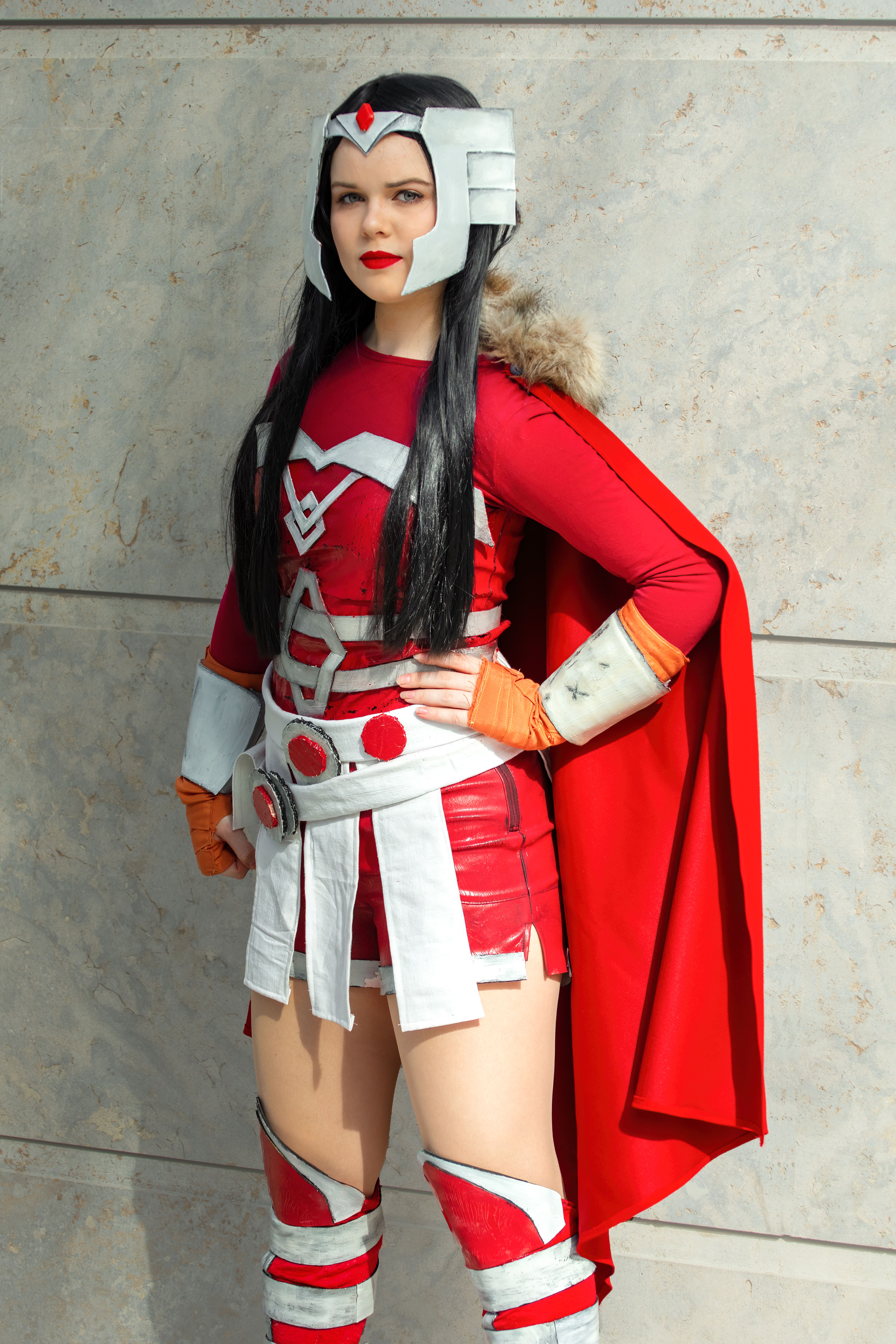 A woman in a red superhero costume poses in Leipzig, Germany.