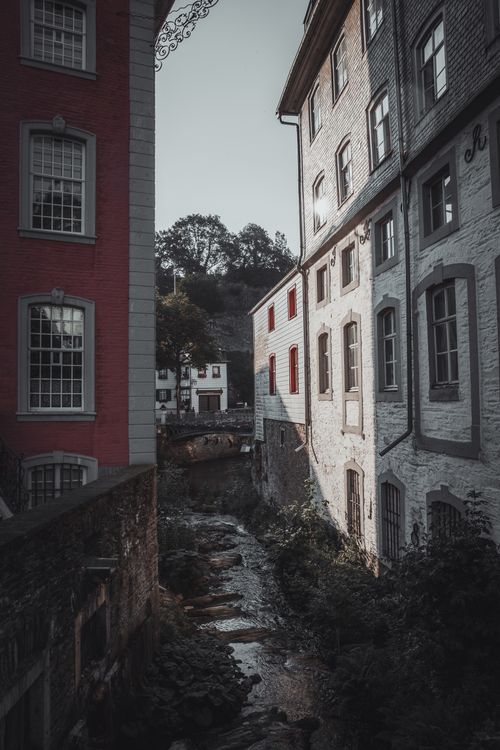 Free Charming view of historic Monschau with European architecture and a flowing stream. Stock Photo
