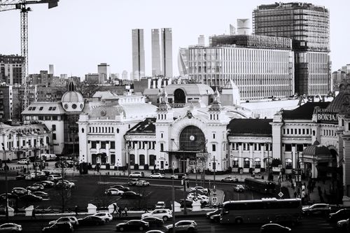 Free Monochrome image of Moscow skyline featuring Belorussky Railway Station with traffic. Stock Photo