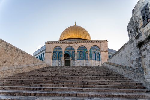 Free A breathtaking image of the Dome of the Rock's ornate facade and golden dome in Jerusalem, a renowned religious landmark. Stock Photo