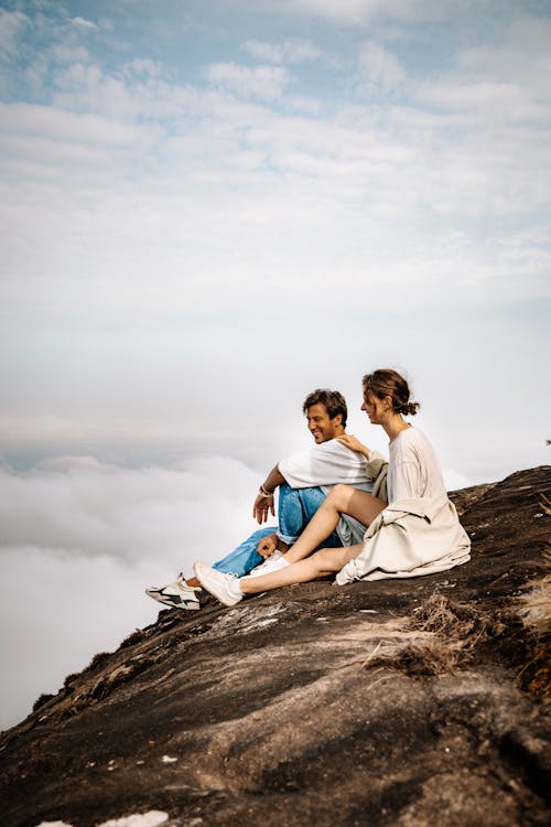 Couple sitting on a Cliff 