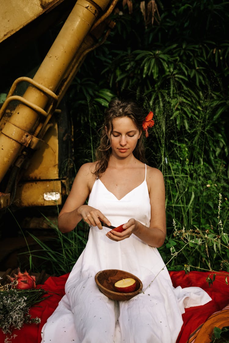 Woman Cutting A Fruit 