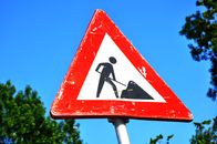 Close-up Photography of Red and White Road Signage