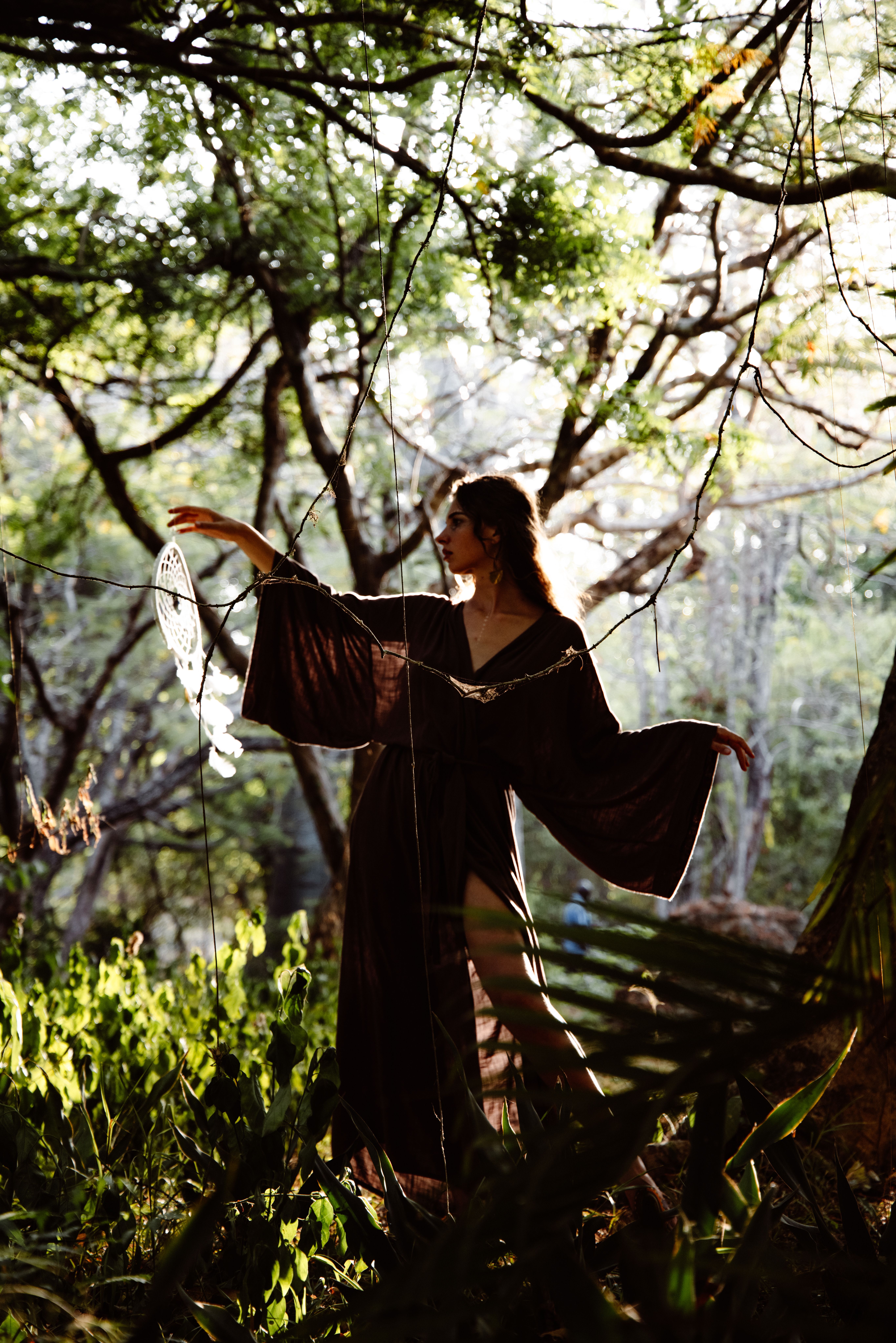A Woman in Brown Long Dress Posing in the Forest · Free Stock Photo