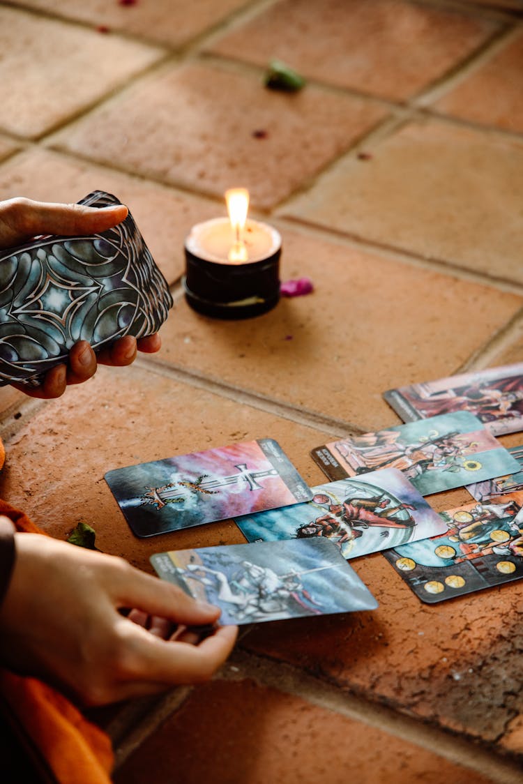 Woman Hand Placing Cards On Floor