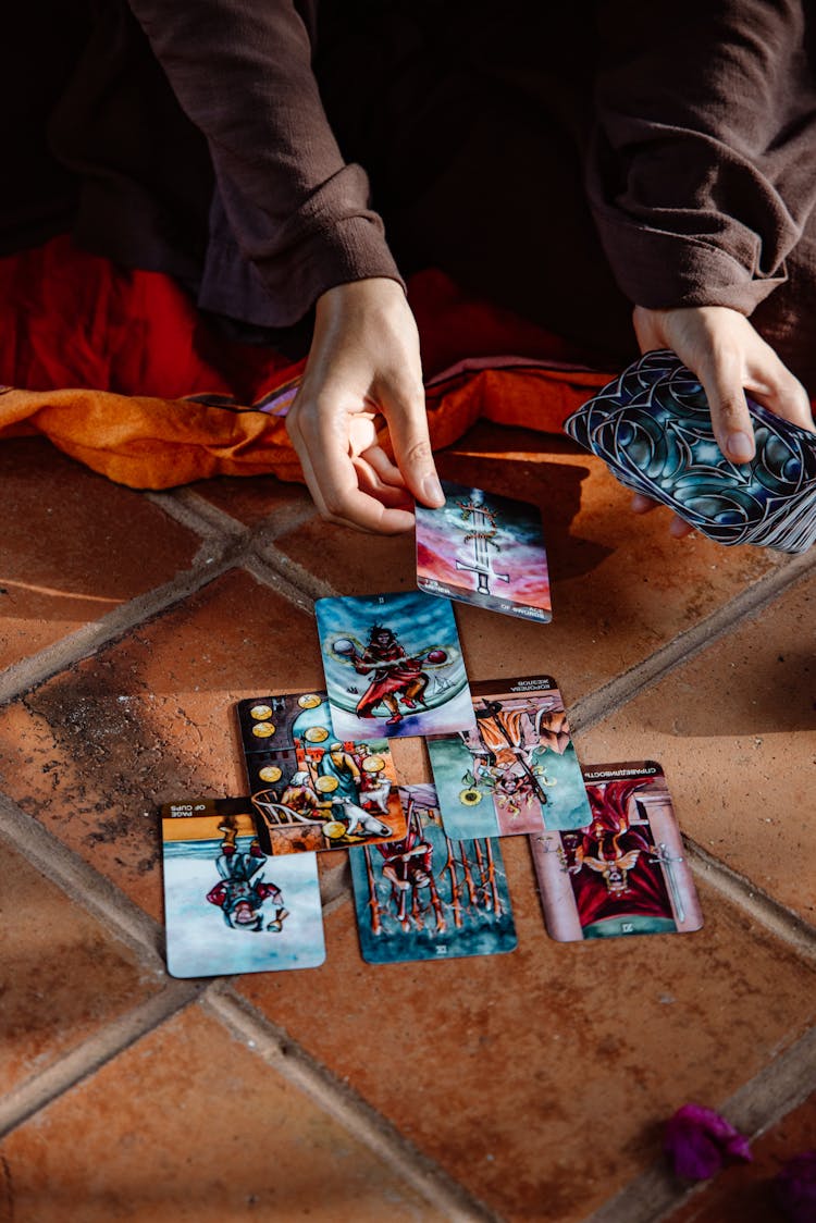 A Person Using Tarot Cards