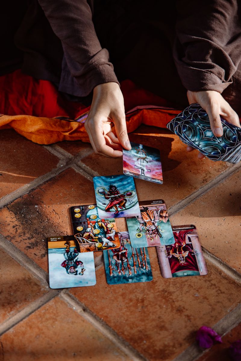 Cards laid out on a tiled floor during a reading