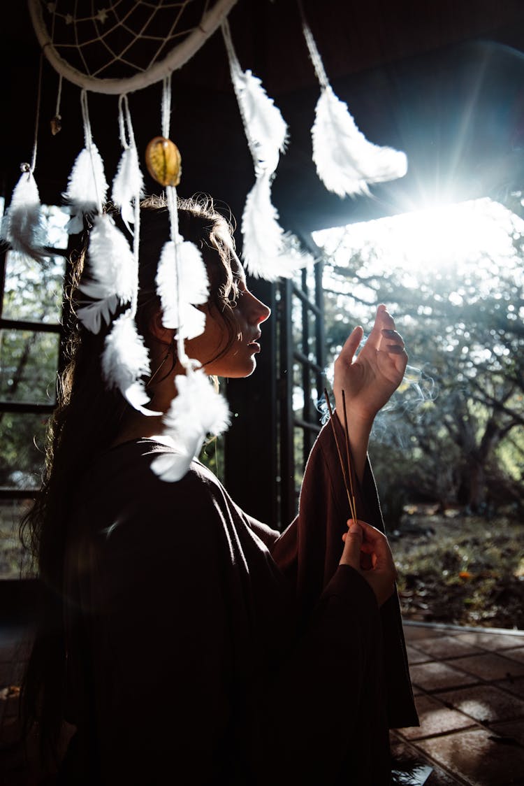 Girl In Long Clothes In Shed With Shamanic Accessories