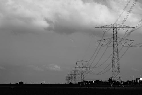 Gray Steel Electric Posts Under Gray Sky