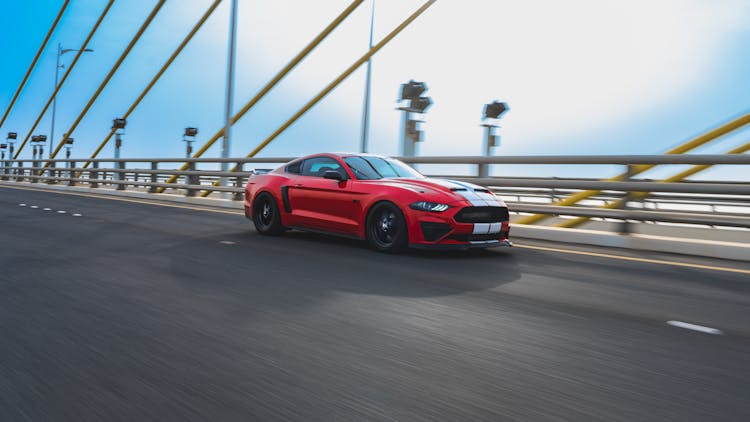 Moving Red Car On A Road 