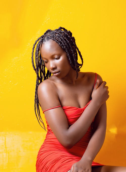 Woman in Orange Dress With Dreadlocks