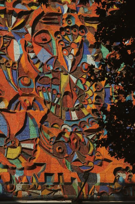 Colorful abstract mosaic art on a wall in Tbilisi, Georgia.