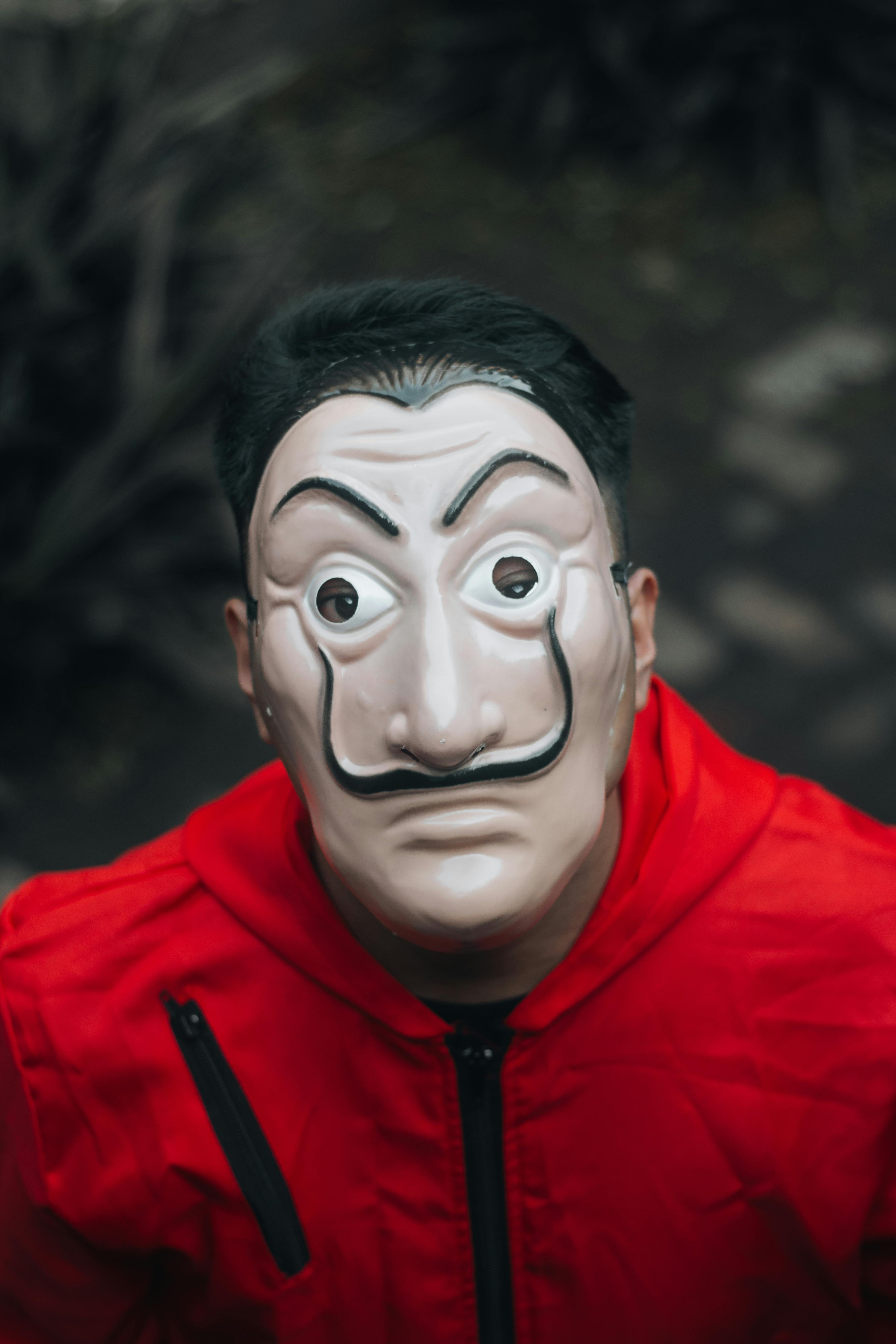 Close-Up Shot of a Person Wearing a Robber Mask · Free Stock Photo